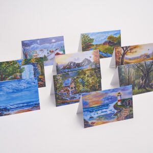 A set of eight cards with paintings on them.