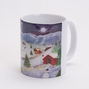 A mug with a painting of a snowy mountain