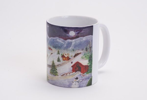A mug with a painting of a snowy mountain